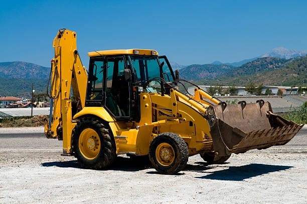 Yellow backhoe loader for heavy equipment work