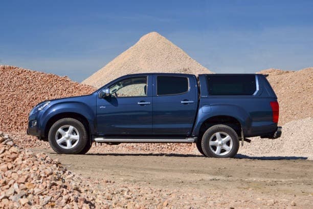 Blue pickup truck parked in the yard